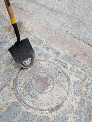 Shovel on a NYC Parks & Recreation manhole cover.